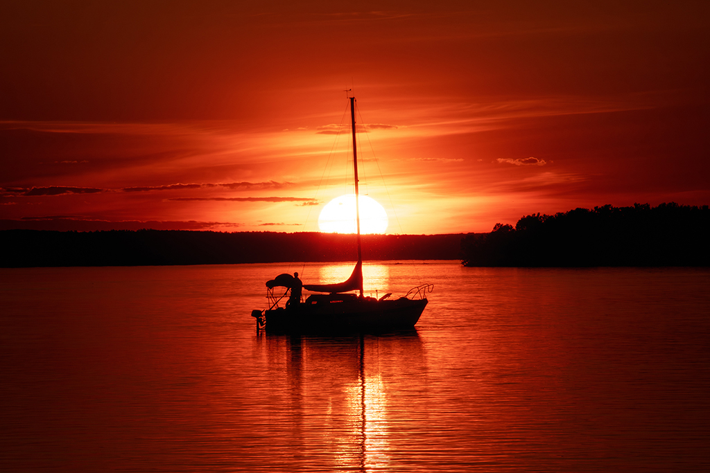 Sunset by the river—where golden light dances on gentle currents. Britannia, Ottawa, Ontario